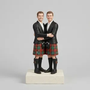 Custom wedding cake topper of a couple in Scottish kilts.